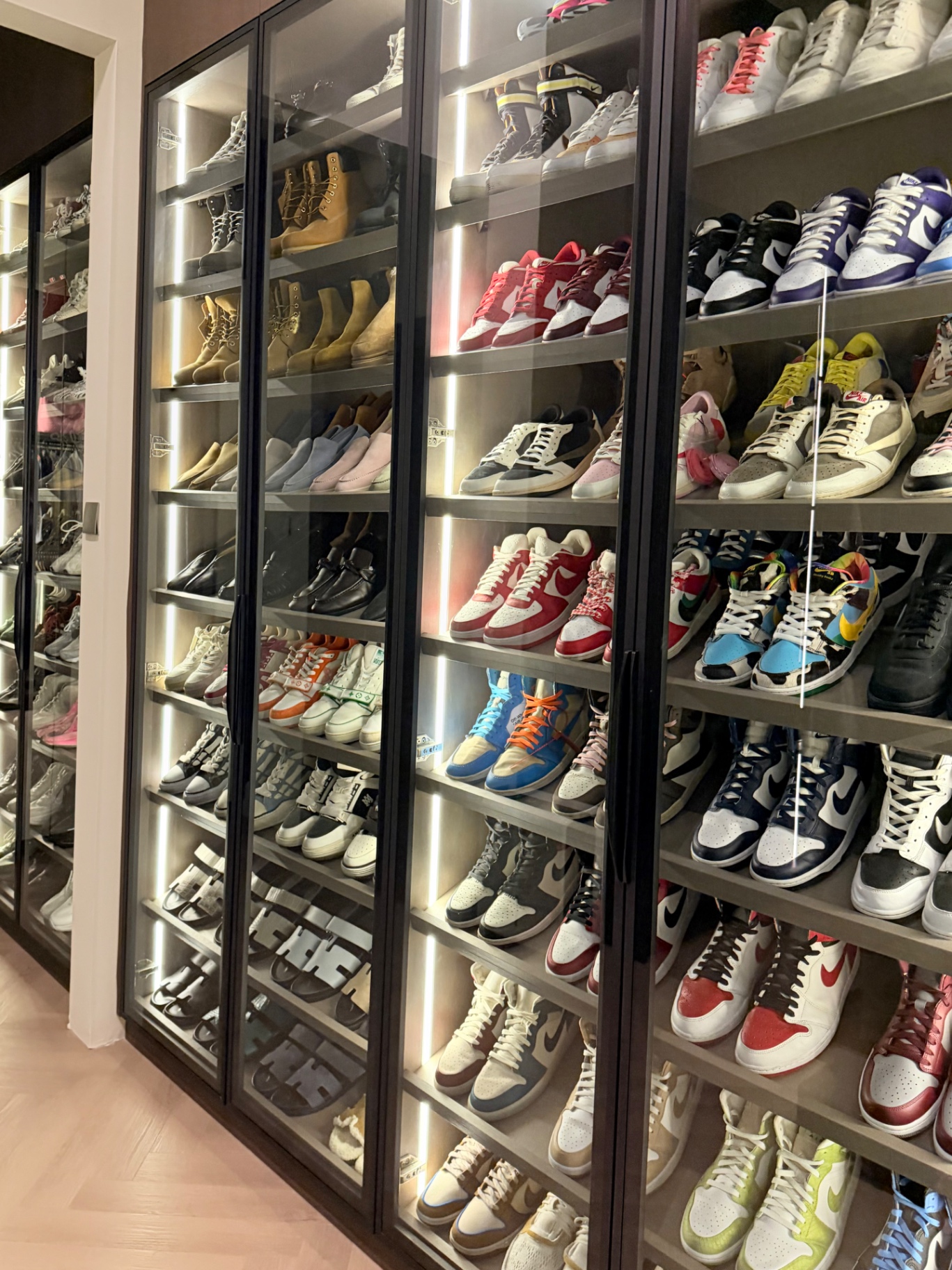 Trainers displayed in lit glass cabinets